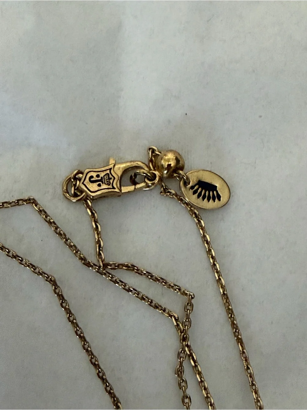 Juicy Couture gold tone